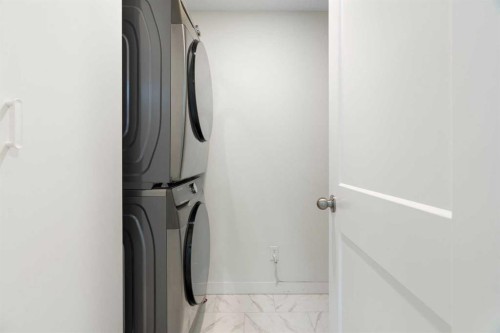 211 Elgin Meadows Gardens Se, Calgary, AB - Indoor Photo Showing Laundry Room