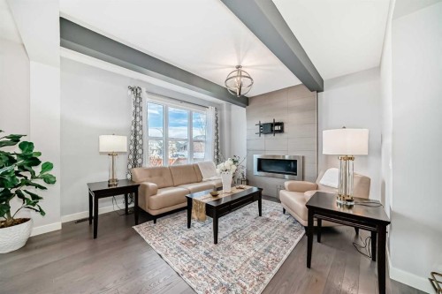 98 Legacy Lane Se, Calgary, AB - Indoor Photo Showing Living Room With Fireplace