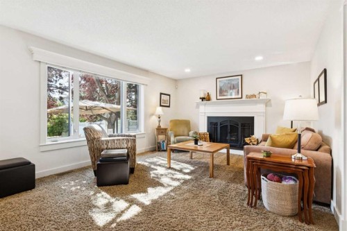 41 Shannon Circle Sw, Calgary, AB - Indoor Photo Showing Living Room With Fireplace