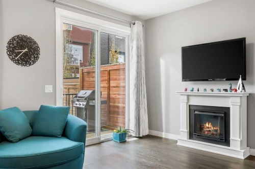 3 Sage Bluff Heights Nw, Calgary, AB - Indoor Photo Showing Living Room With Fireplace