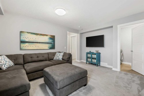 3 Sage Bluff Heights Nw, Calgary, AB - Indoor Photo Showing Living Room With Fireplace