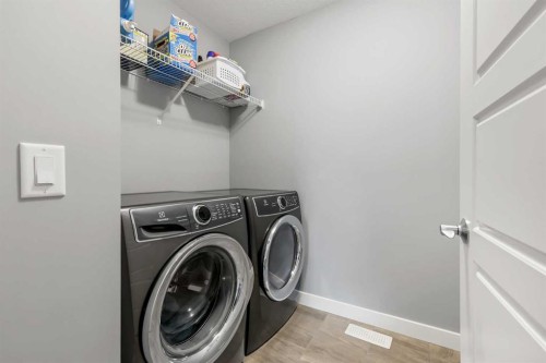 3 Sage Bluff Heights Nw, Calgary, AB - Indoor Photo Showing Laundry Room