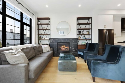 4929 20 Street Sw, Calgary, AB - Indoor Photo Showing Living Room With Fireplace