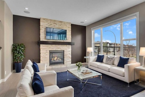 204 Sunset View, Cochrane, AB - Indoor Photo Showing Living Room With Fireplace