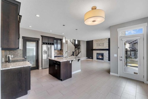 204 Sunset View, Cochrane, AB - Indoor Photo Showing Kitchen With Upgraded Kitchen