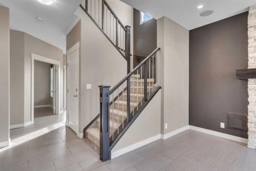 204 Sunset View, Cochrane, AB - Indoor Photo Showing Other Room With Fireplace
