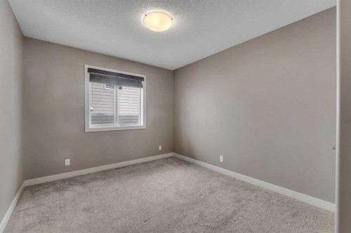 204 Sunset View, Cochrane, AB - Indoor Photo Showing Other Room