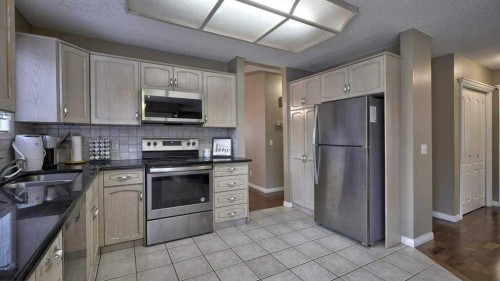 138 Sierra Morena Green Sw, Calgary, AB - Indoor Photo Showing Kitchen With Stainless Steel Kitchen
