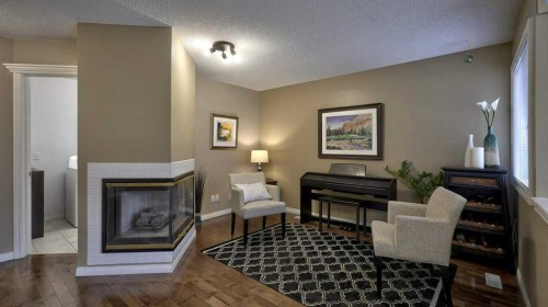 138 Sierra Morena Green Sw, Calgary, AB - Indoor Photo Showing Living Room With Fireplace