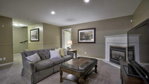 138 Sierra Morena Green Sw, Calgary, AB - Indoor Photo Showing Living Room With Fireplace