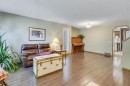 212 Mckerrell Way Se, Calgary, AB  - Indoor Photo Showing Living Room 
