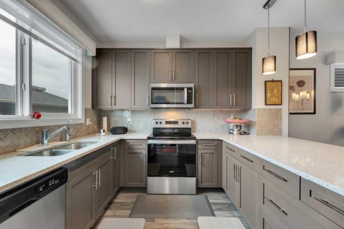 784 Livingston Hill Ne, Calgary, AB - Indoor Photo Showing Kitchen With Stainless Steel Kitchen With Double Sink