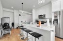 1415-111 Wolf Creek Drive Se, Calgary, AB  - Indoor Photo Showing Kitchen With Stainless Steel Kitchen With Upgraded Kitchen 