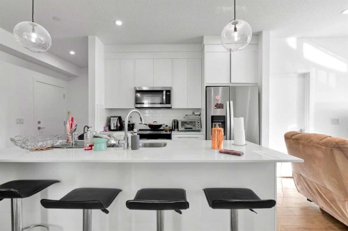1415-111 Wolf Creek Drive Se, Calgary, AB - Indoor Photo Showing Kitchen With Stainless Steel Kitchen With Upgraded Kitchen