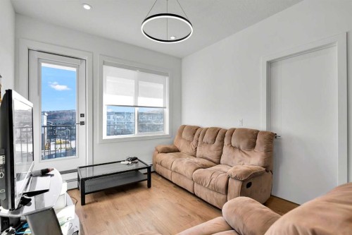 1415-111 Wolf Creek Drive Se, Calgary, AB - Indoor Photo Showing Living Room