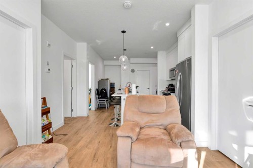 1415-111 Wolf Creek Drive Se, Calgary, AB - Indoor Photo Showing Living Room
