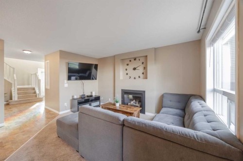 177 Silverado Range View Sw, Calgary, AB - Indoor Photo Showing Living Room With Fireplace