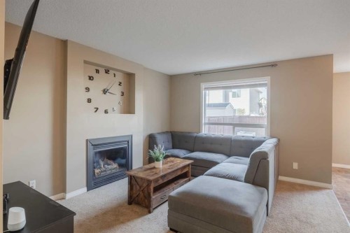 177 Silverado Range View Sw, Calgary, AB - Indoor Photo Showing Living Room With Fireplace