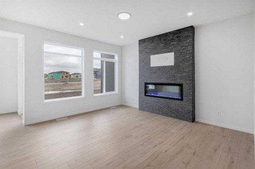 370 Corner Glen Way Ne, Calgary, AB - Indoor Photo Showing Living Room With Fireplace