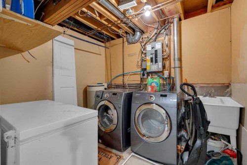 28 Woodglen Close Sw, Calgary, AB - Indoor Photo Showing Laundry Room