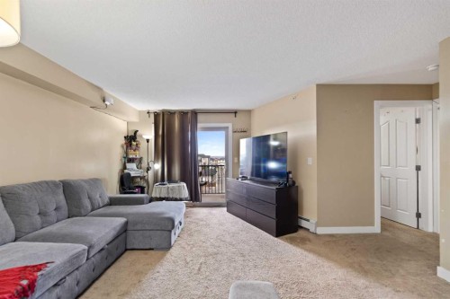 404-355 Taralake Way Ne, Calgary, AB - Indoor Photo Showing Living Room