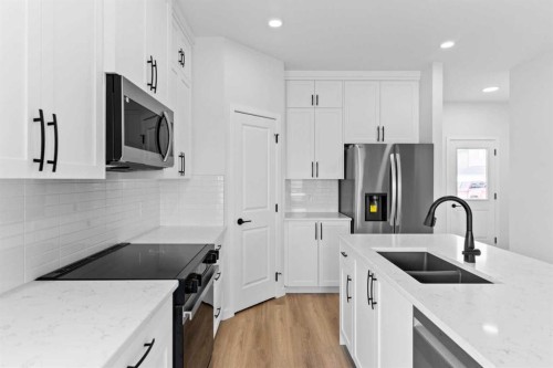 231 Vista Road, Crossfield, AB - Indoor Photo Showing Kitchen With Stainless Steel Kitchen With Double Sink With Upgraded Kitchen