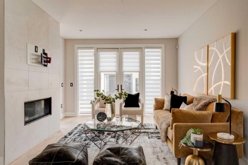 720 15 Street Nw, Calgary, AB - Indoor Photo Showing Living Room With Fireplace