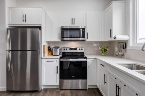212 142 Avenue Nw, Calgary, AB - Indoor Photo Showing Kitchen With Stainless Steel Kitchen With Double Sink