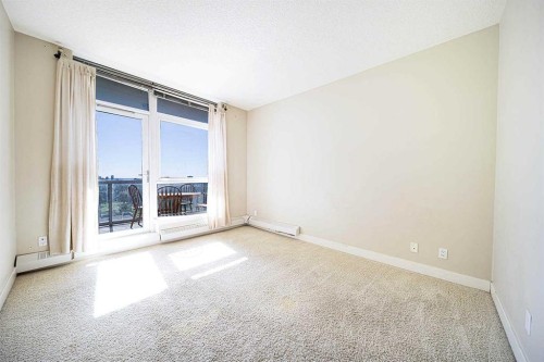 707-77 Spruce Place Sw, Calgary, AB - Indoor Photo Showing Other Room