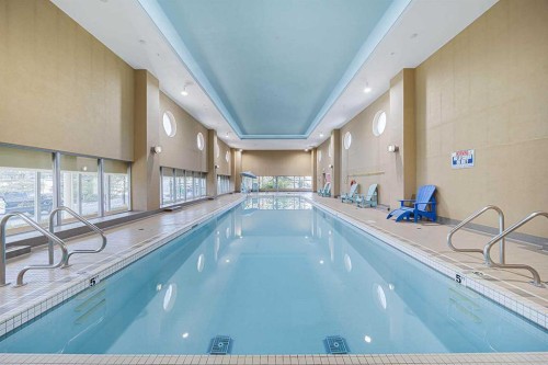 707-77 Spruce Place Sw, Calgary, AB - Indoor Photo Showing Other Room With In Ground Pool