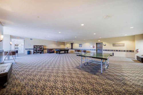 707-77 Spruce Place Sw, Calgary, AB - Indoor Photo Showing Other Room