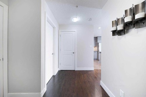 707-77 Spruce Place Sw, Calgary, AB - Indoor Photo Showing Other Room