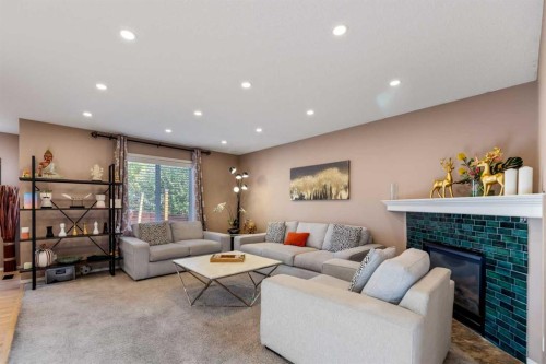 182 Tuscany Ravine Road Nw, Calgary, AB - Indoor Photo Showing Living Room With Fireplace