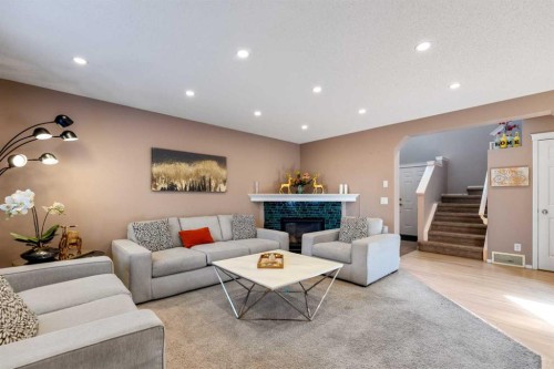 182 Tuscany Ravine Road Nw, Calgary, AB - Indoor Photo Showing Living Room