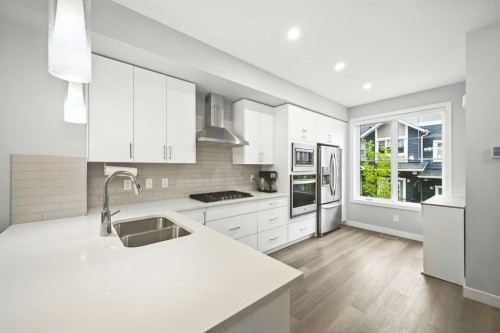 908 Sage Hill Grove Nw, Calgary, AB - Indoor Photo Showing Kitchen With Double Sink With Upgraded Kitchen
