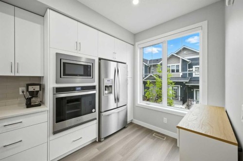 908 Sage Hill Grove Nw, Calgary, AB - Indoor Photo Showing Kitchen With Upgraded Kitchen