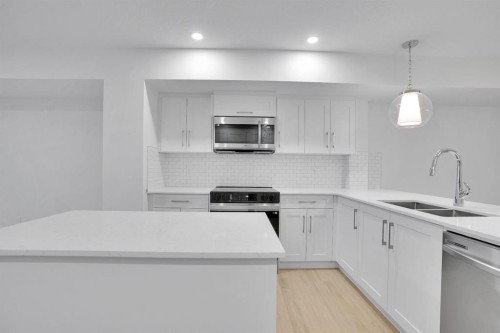186 Belmont Street Sw, Calgary, AB - Indoor Photo Showing Kitchen With Double Sink With Upgraded Kitchen