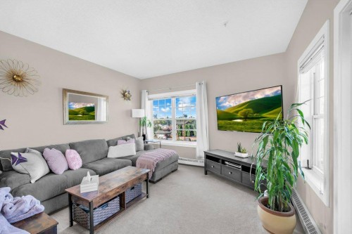 301-1414 17 Street Se, Calgary, AB - Indoor Photo Showing Living Room
