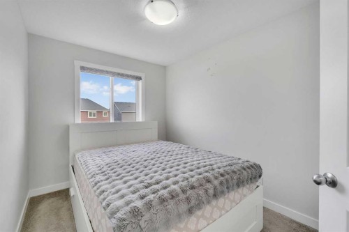 10 Midtown Boulevard Sw, Airdrie, AB - Indoor Photo Showing Bedroom