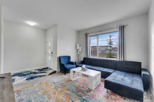 10 Midtown Boulevard Sw, Airdrie, AB - Indoor Photo Showing Living Room