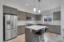 10 Midtown Boulevard Sw, Airdrie, AB  - Indoor Photo Showing Kitchen With Upgraded Kitchen 