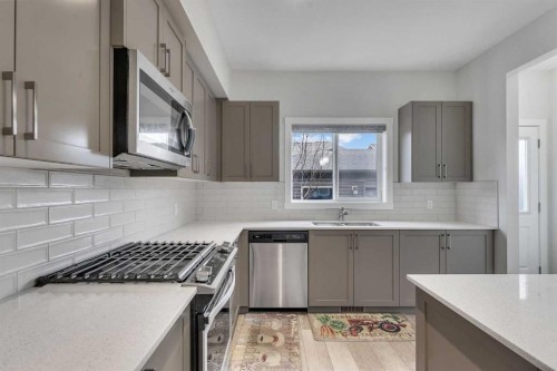 10 Midtown Boulevard Sw, Airdrie, AB - Indoor Photo Showing Kitchen With Upgraded Kitchen