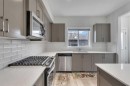 10 Midtown Boulevard Sw, Airdrie, AB  - Indoor Photo Showing Kitchen With Upgraded Kitchen 