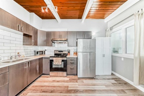 623 68 Avenue Sw, Calgary, AB - Indoor Photo Showing Kitchen With Double Sink With Upgraded Kitchen