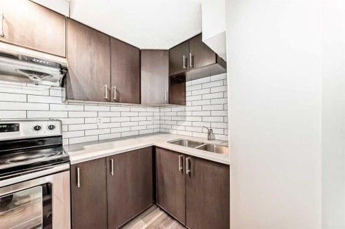 623 68 Avenue Sw, Calgary, AB - Indoor Photo Showing Kitchen With Double Sink With Upgraded Kitchen