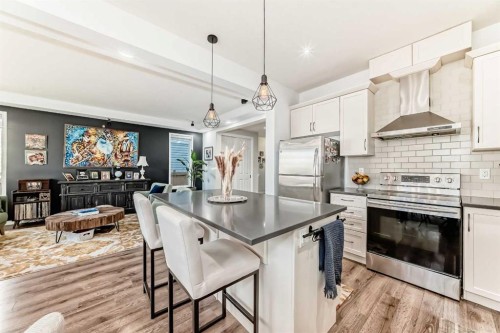 763 Windridge Road Sw, Airdrie, AB - Indoor Photo Showing Kitchen With Upgraded Kitchen