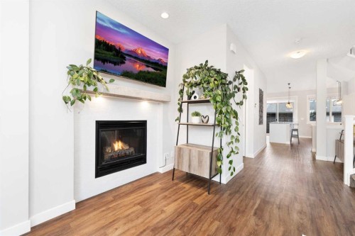 174 Seton Grove Se, Calgary, AB - Indoor Photo Showing Living Room With Fireplace