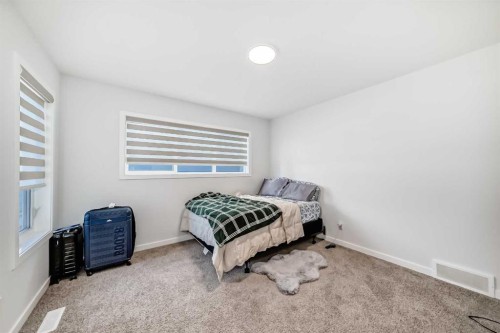 82 Magnolia Court Se, Calgary, AB - Indoor Photo Showing Bedroom