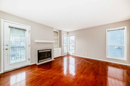 83 Harvest Gold Circle Ne, Calgary, AB - Indoor Photo Showing Other Room With Fireplace