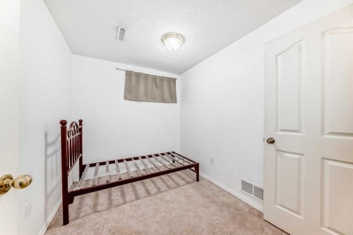 83 Harvest Gold Circle Ne, Calgary, AB - Indoor Photo Showing Bedroom
